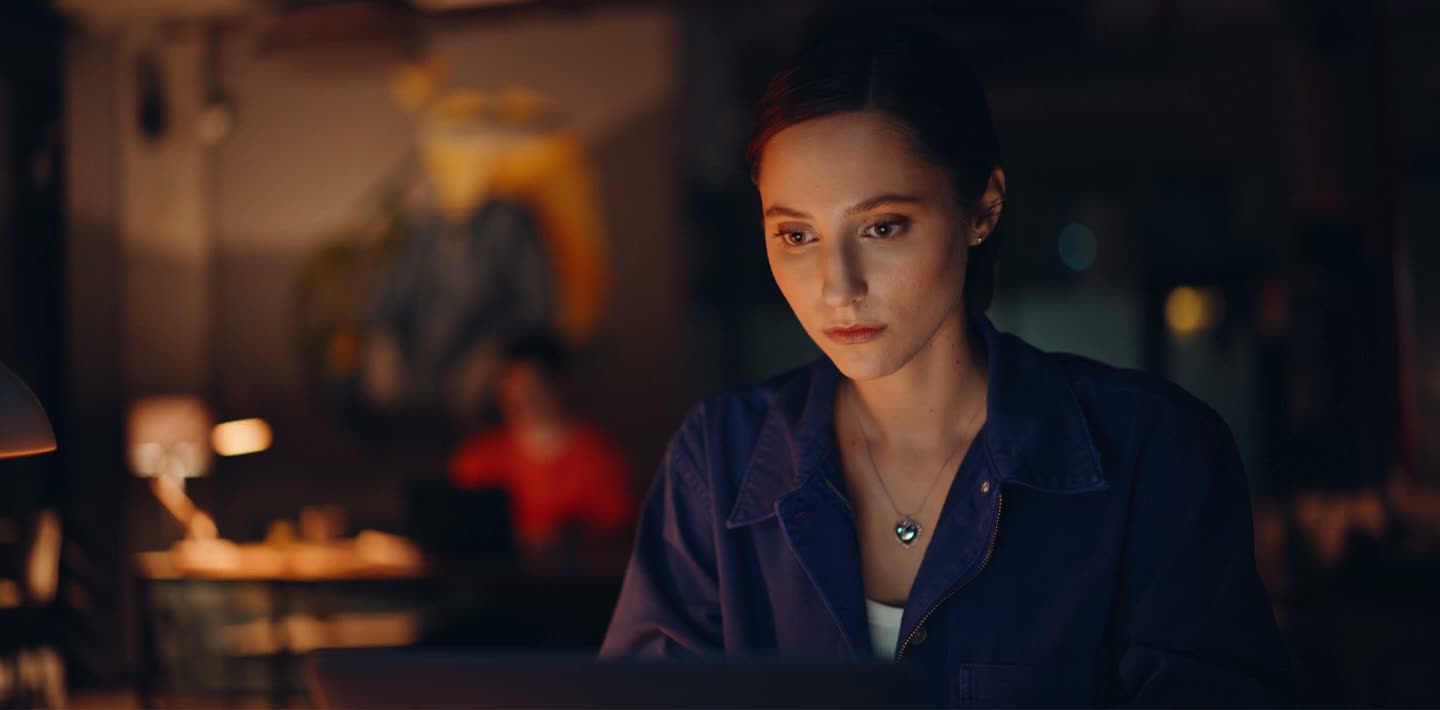 A writer works late into the night on a story